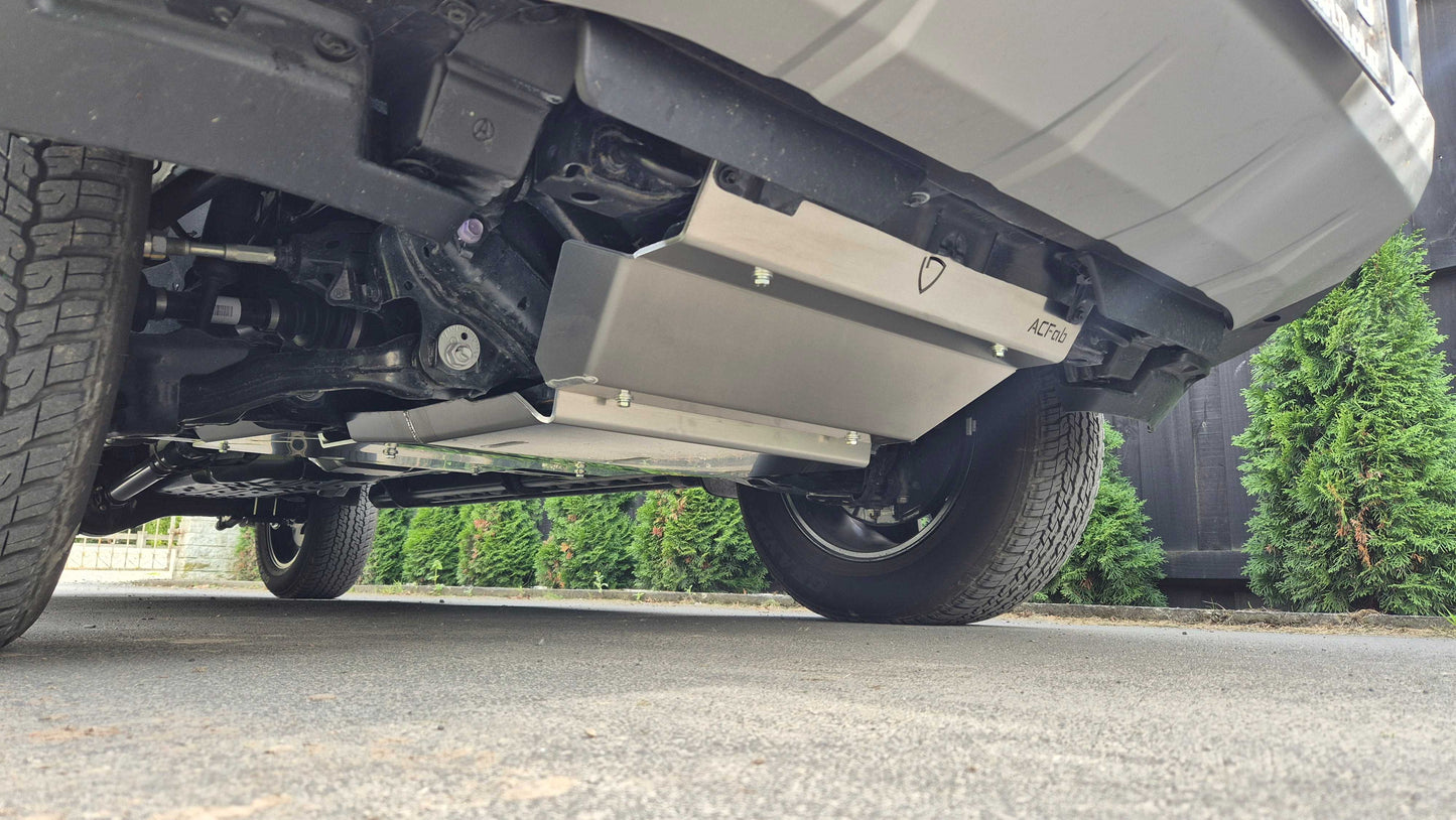 Close-up of a vehicle's undercarriage with a blurred background Toyota Hilux N90 Bash Plates