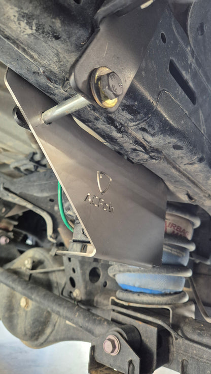 Close-up of a mechanical component with a brand logo on a vehicle engine.