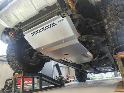 Bash plates installed underneath the frame of a vehicle, primarily made of silver-zinc plated steel.