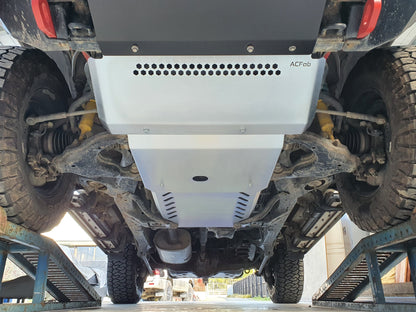 Bash plates installed on the underside of a vehicle, showing the front set and the transfer case guard.